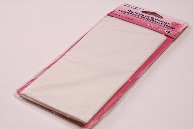 Паутинка на бумажной основе для склеивания ткани 